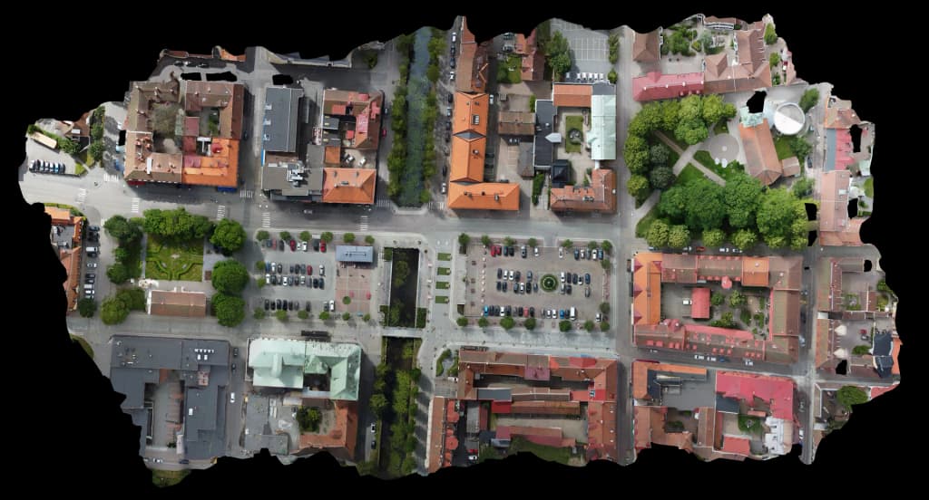 Centrum orthomosaic over Alingsas with streets, parking, buildings, and trees.